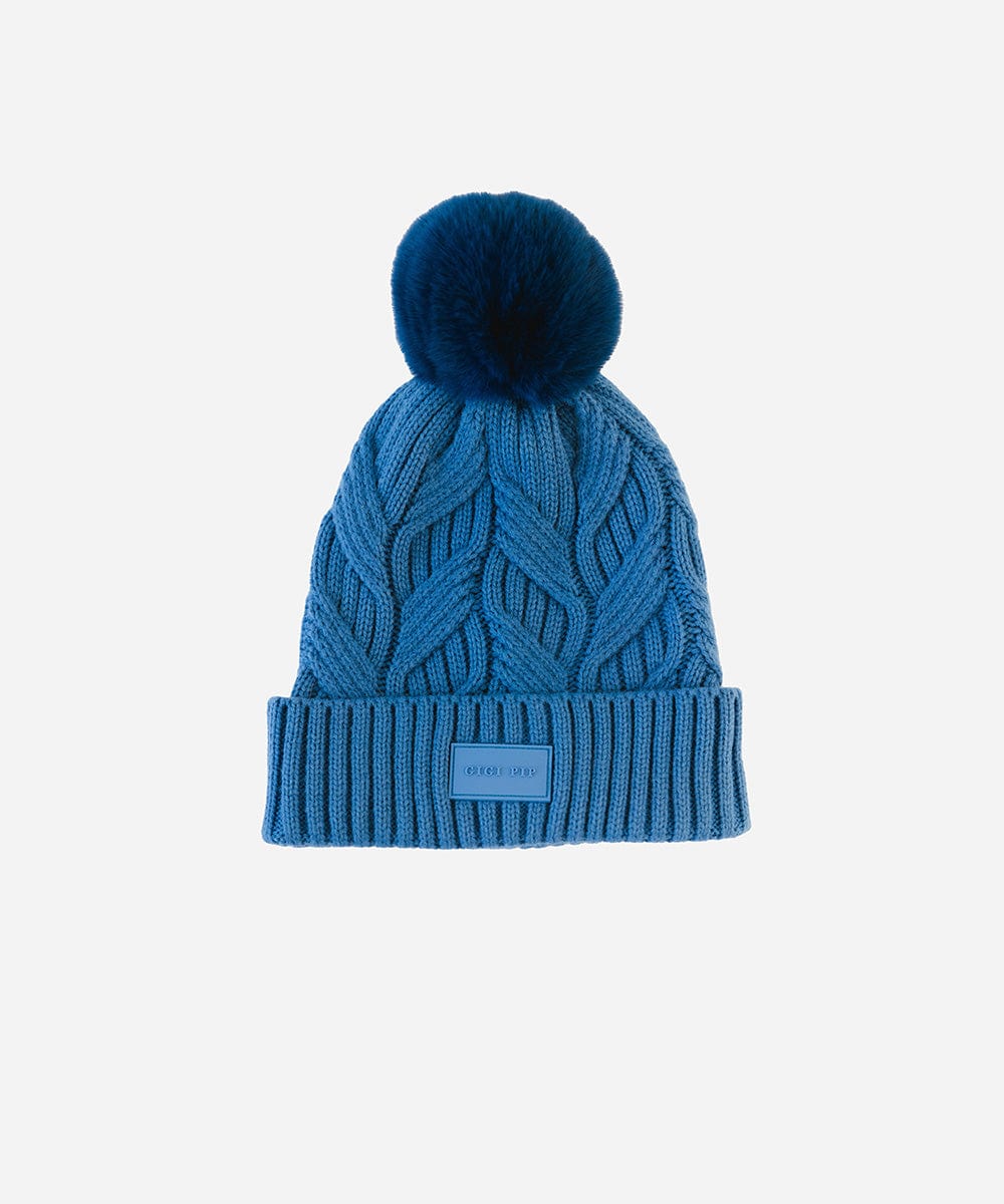 An arctic blue colored knit beanie with a pom-pom on a plain background #color_arctic blue