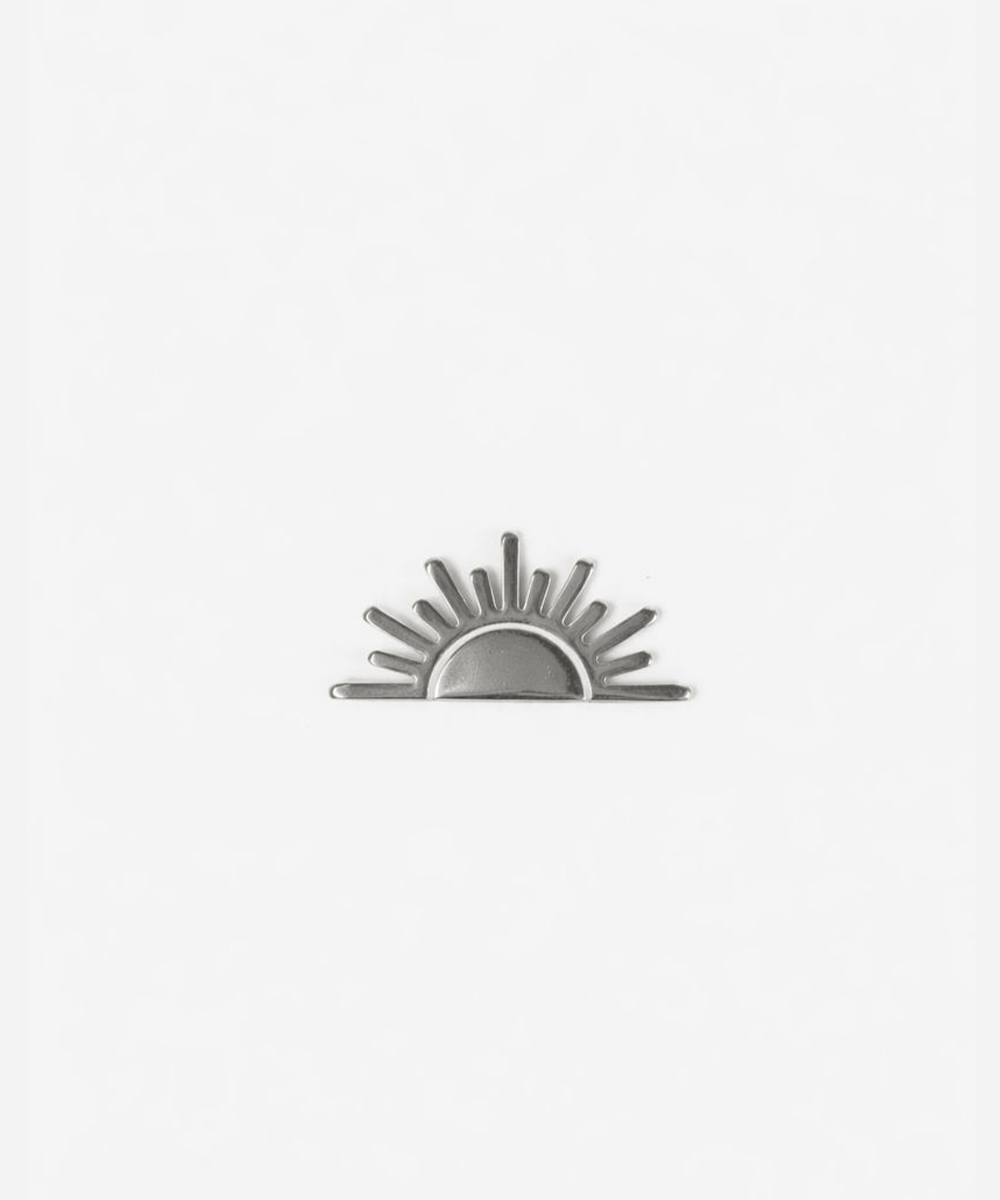 Silver sun-shaped hat pin on a white background #color_silver