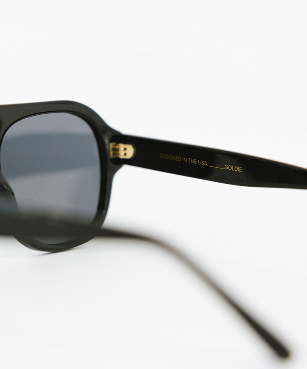 Black aviator sunglasses on a plain background #color_black