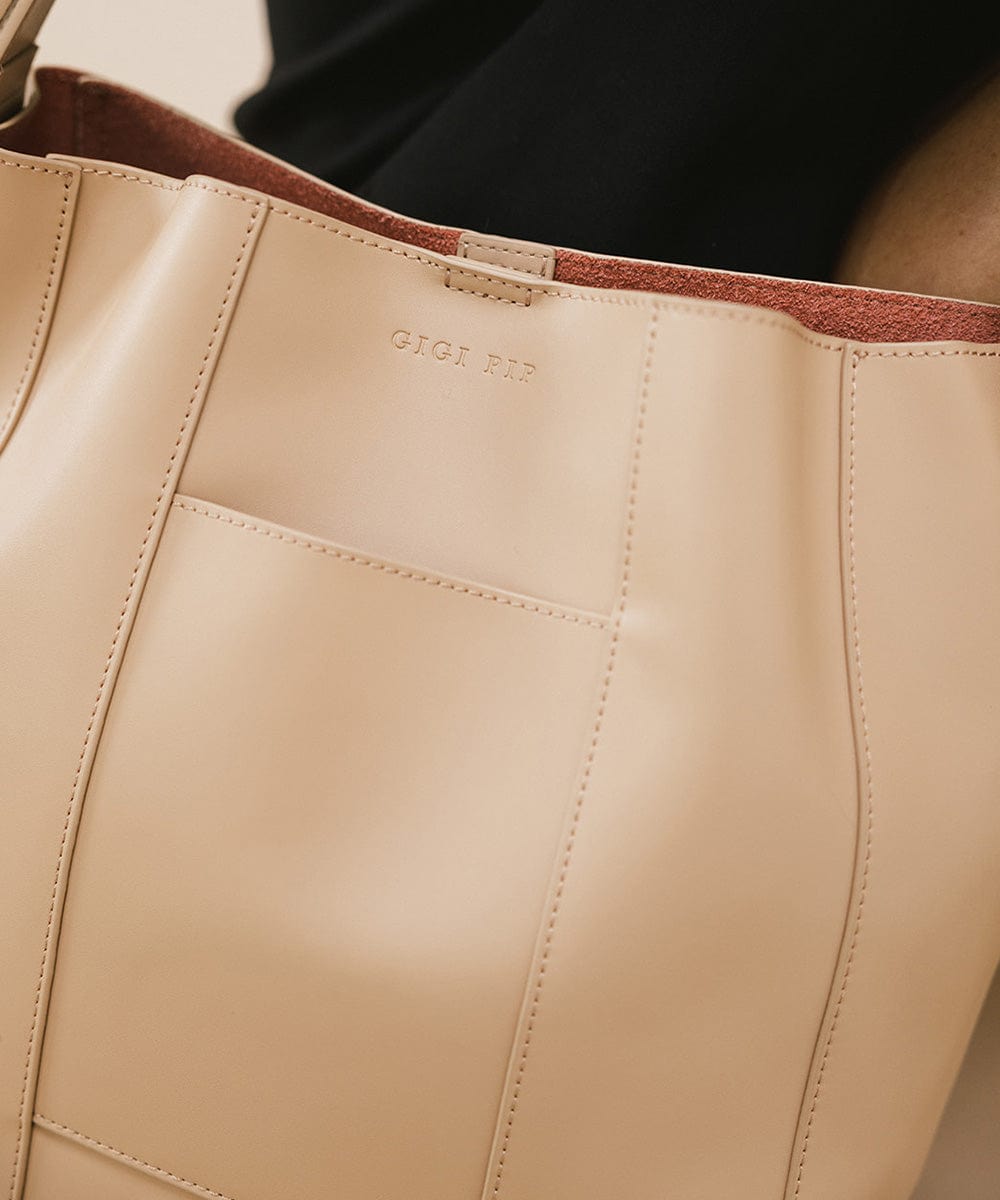 Close up image of a tan Dia everyday leather tote bag  #color_tan