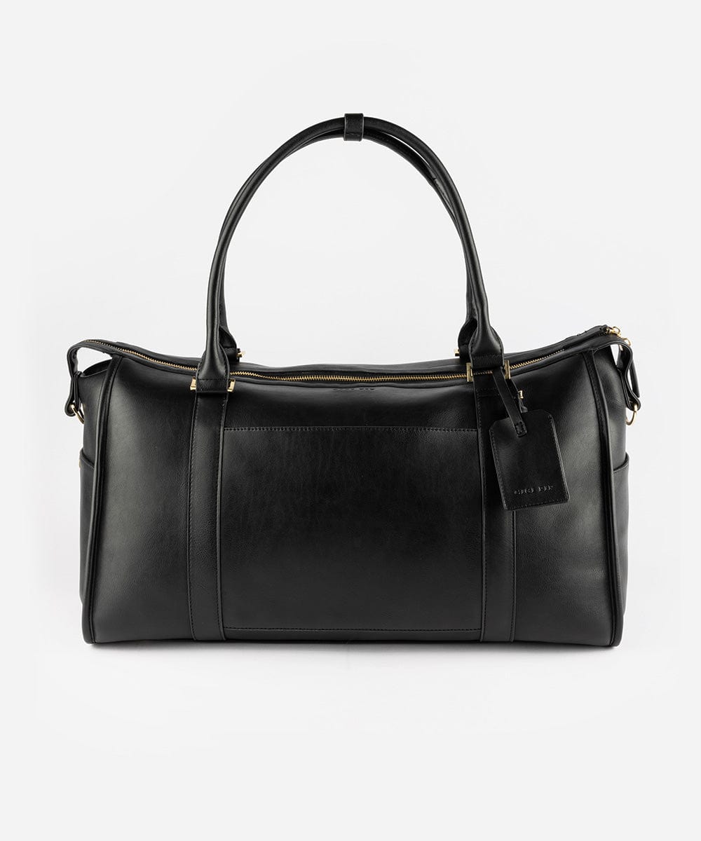 A black vegan leather weekender bag with a detachable shoulder strap and gold-tone hardware against a plain background #color_black