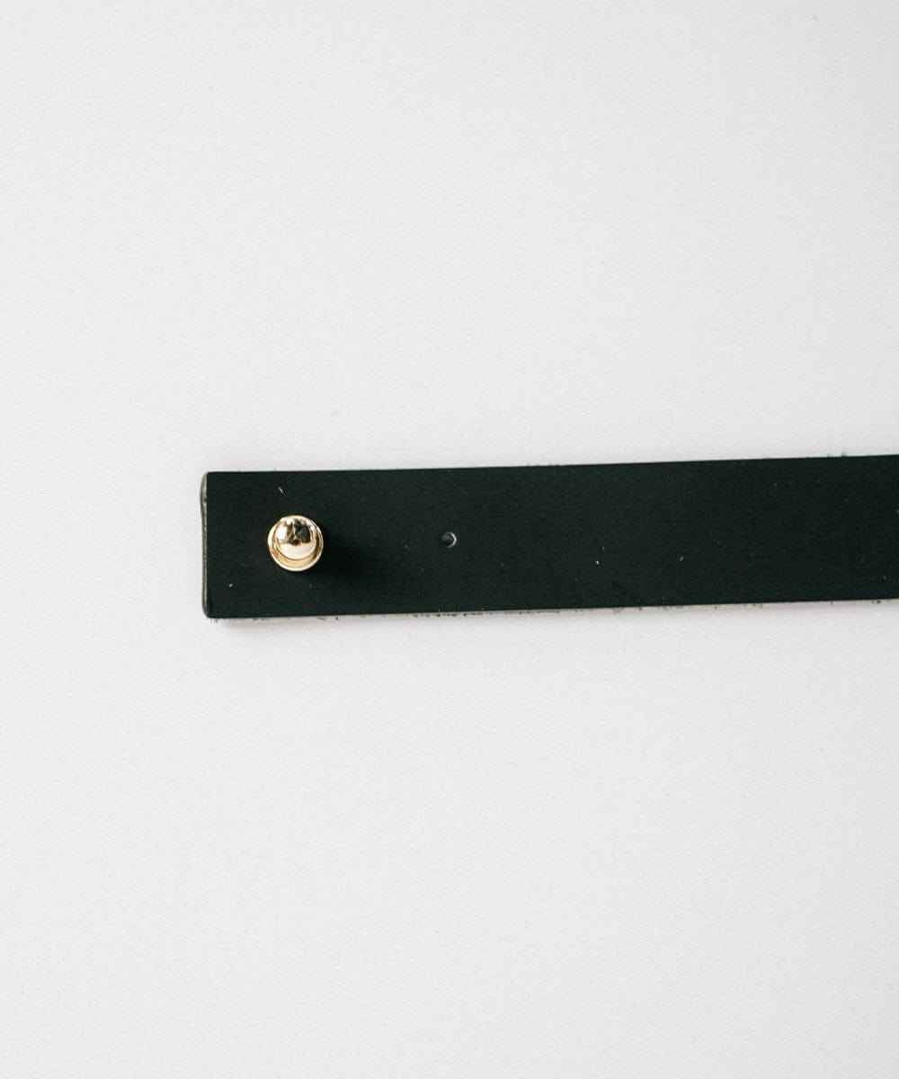 A black leather band with pin on a plain background #color_black