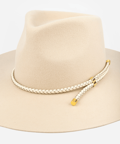 Beige fedora hat with a braided gold band on a light gray background #color_ivory