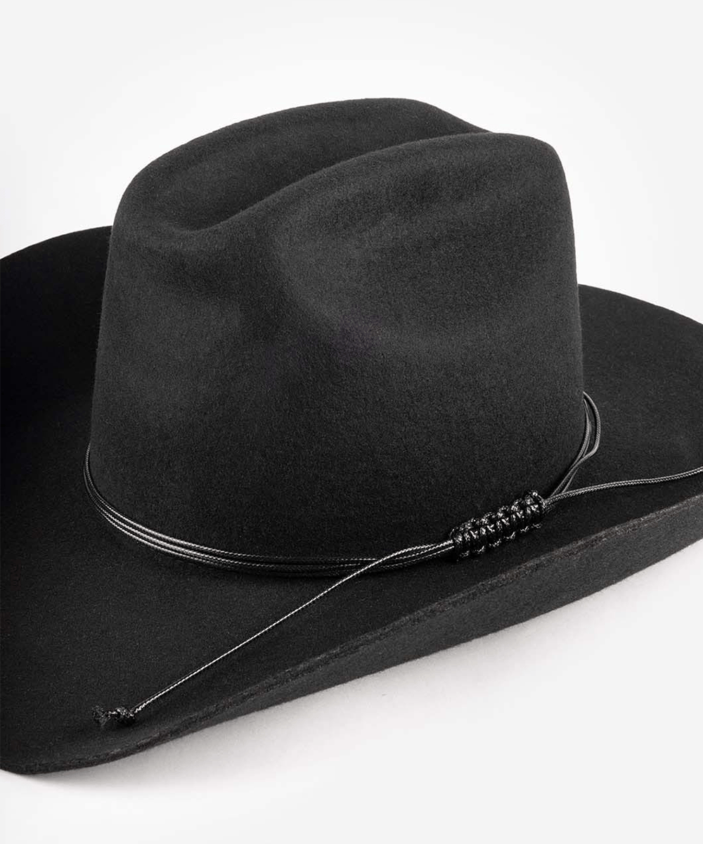 Black cowboy hat with a string triple wrap band on a white background #color_black