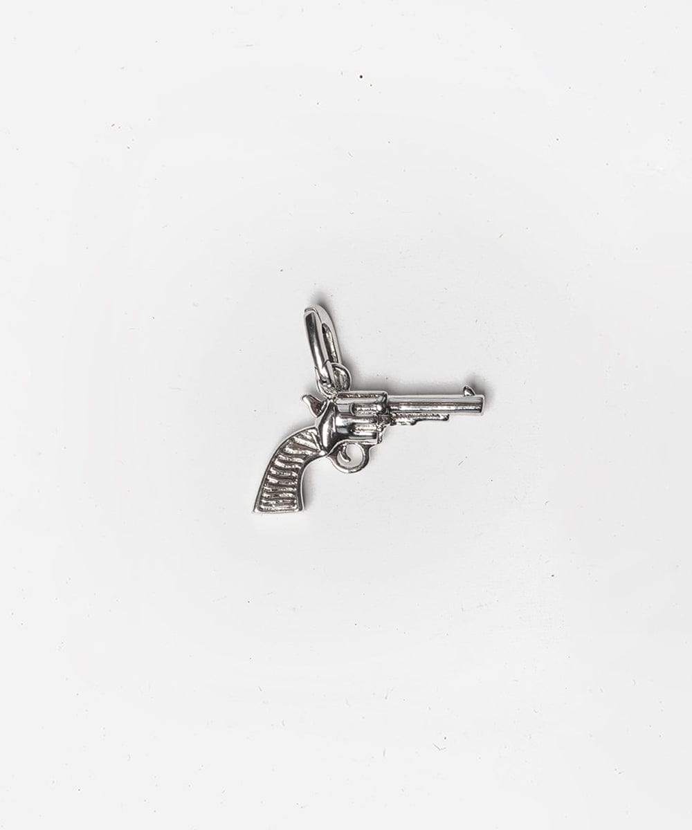 A silver pistol hat charm on a white background #color_silver