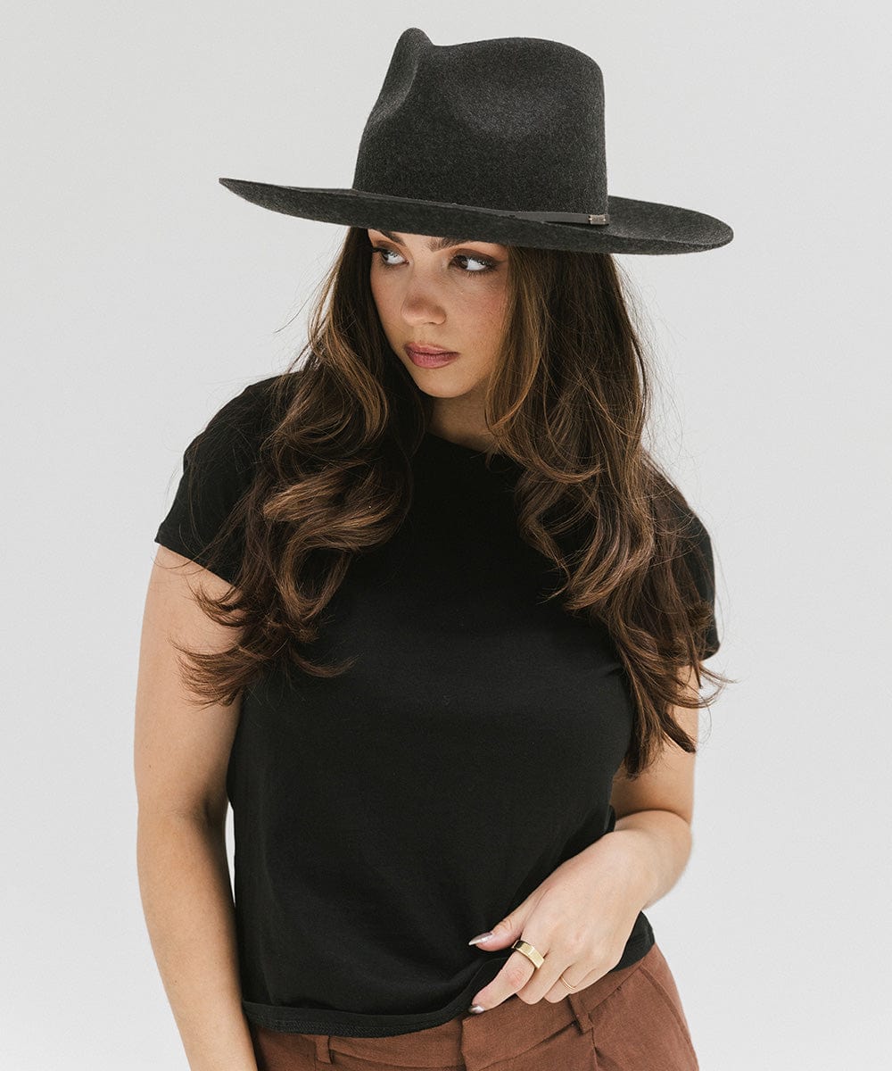 Woman wearing a mix charcoal  colored Rowan Wide Brim Fedora Hat and a black t-shirt against a plain background  #color_mix charcoal
