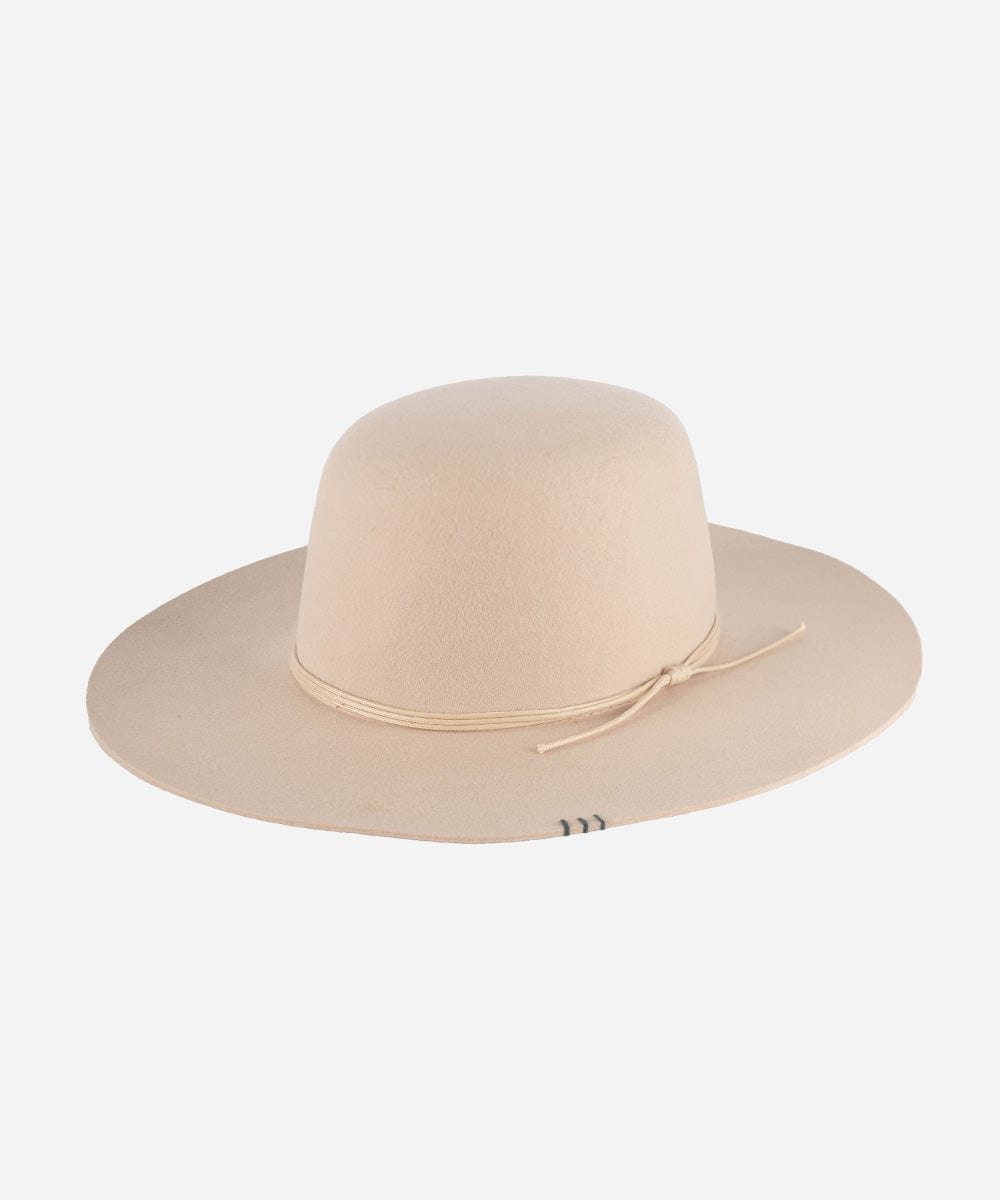 A cream open crown hat with a structured semi-wide brim and a tonal triple-strand waxed leather band.