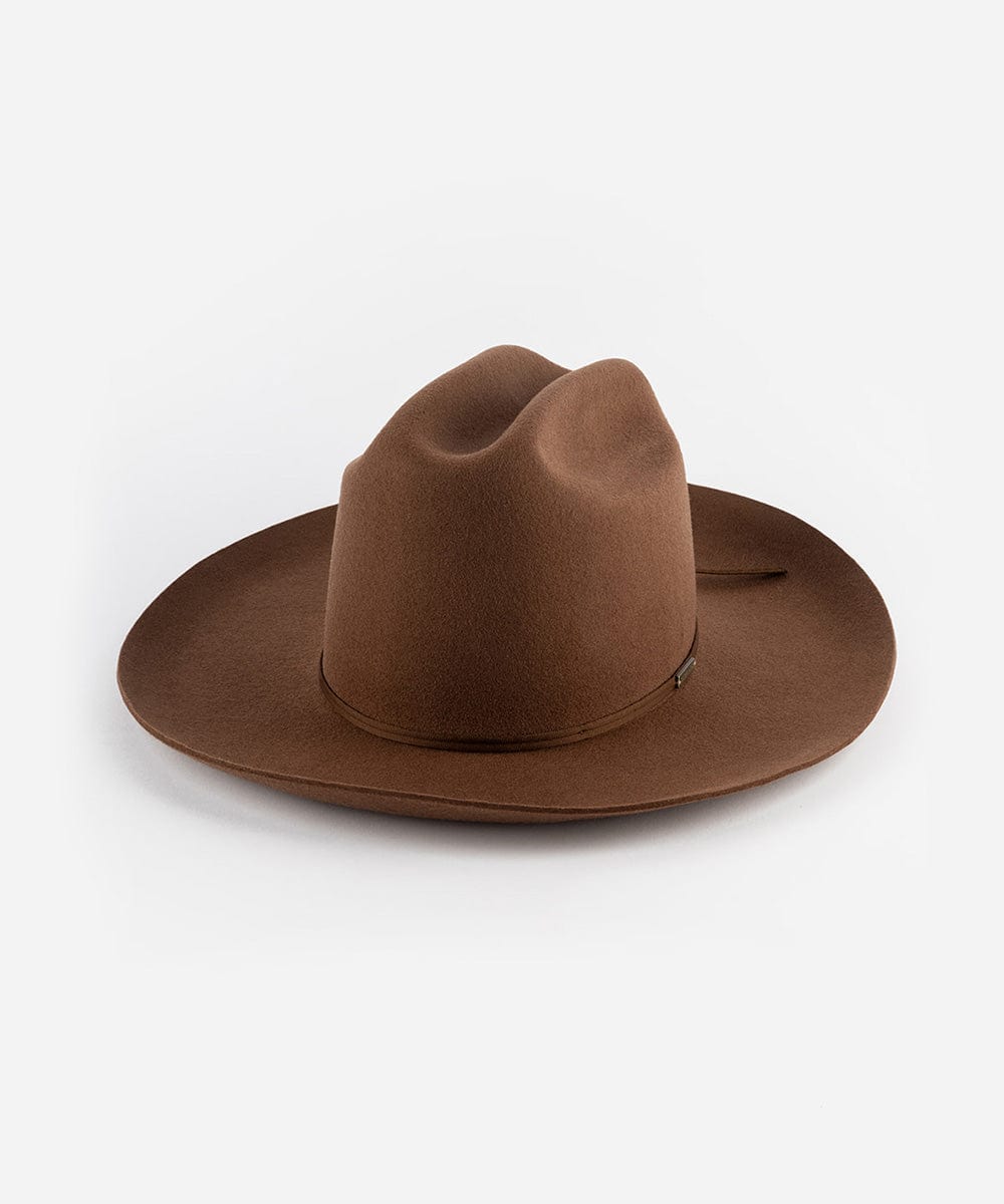 A dark oak colored Western hat with a classic cattleman crown and an upturned brim. It features a tall crown and a stiff brim with a tonal grosgrain band and a brass Gigi Pip pin. #color_dark oak