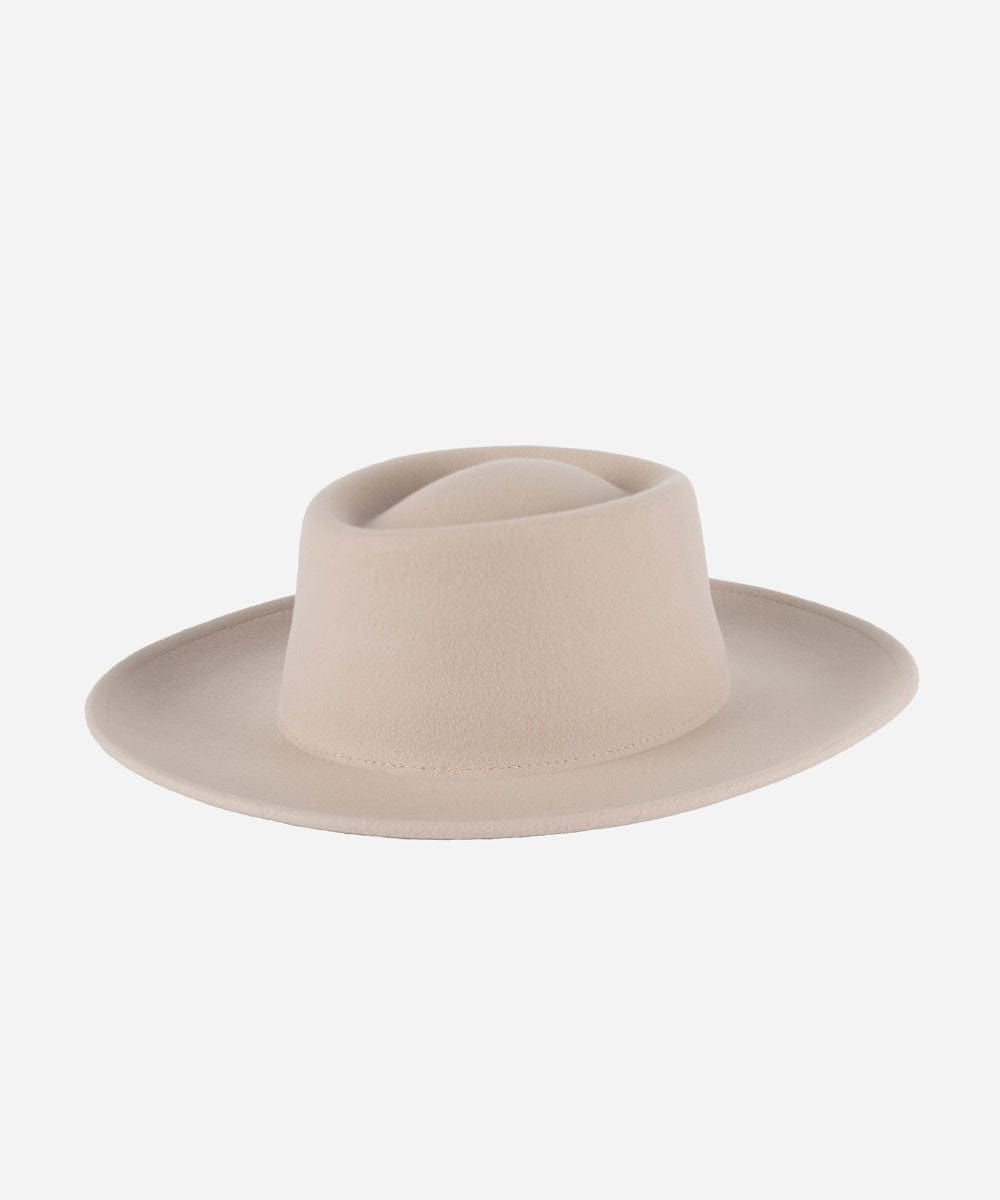 An ivory colored gambler hat with an indented oval crown and an upturned brim against a white background. #color_ivory