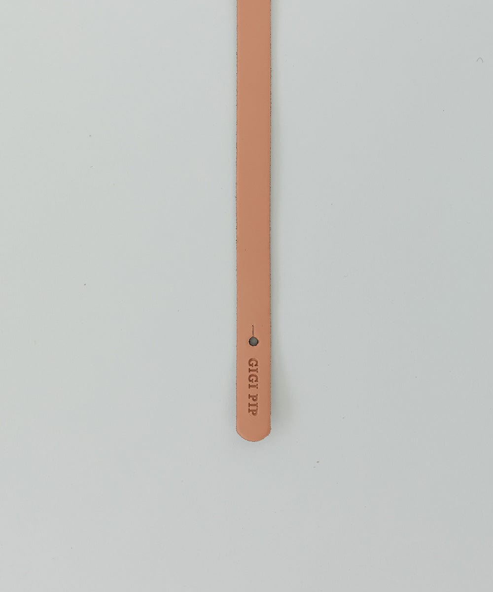 A sunset colored genuine leather thin hat band on a white background #color_sunset