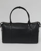 Person showing all the features of a black vegan leather weekender bag against a plain background #color_black
