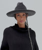 Woman wearing a mix charcoal colored western hat with a pencil brim and a tall crown and a black sweater against a plain background  #color_mix charcoal