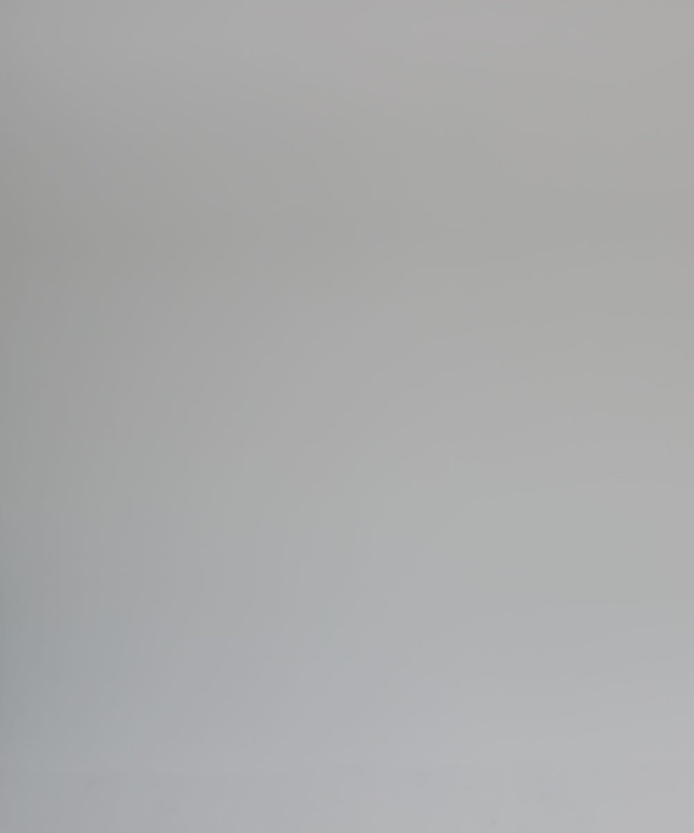 Woman wearing a dark green cowboy hat, a white shirt, brown belt and white pants, posing against a plain background #color_dark green
