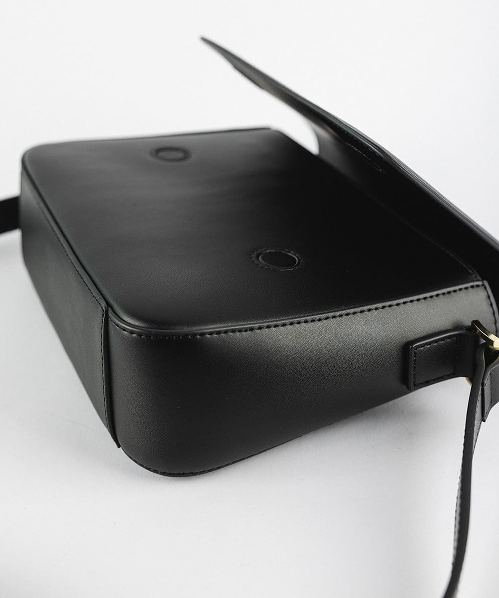 A black Rhys Crossbody Genuine Leather Bag on a plain background   #color_black