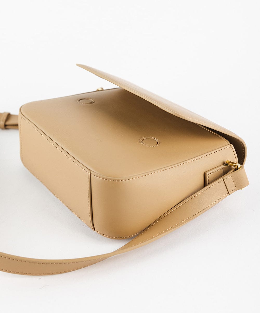 A tan Rhys Crossbody Genuine Leather Bag on a plain background  #color_tan