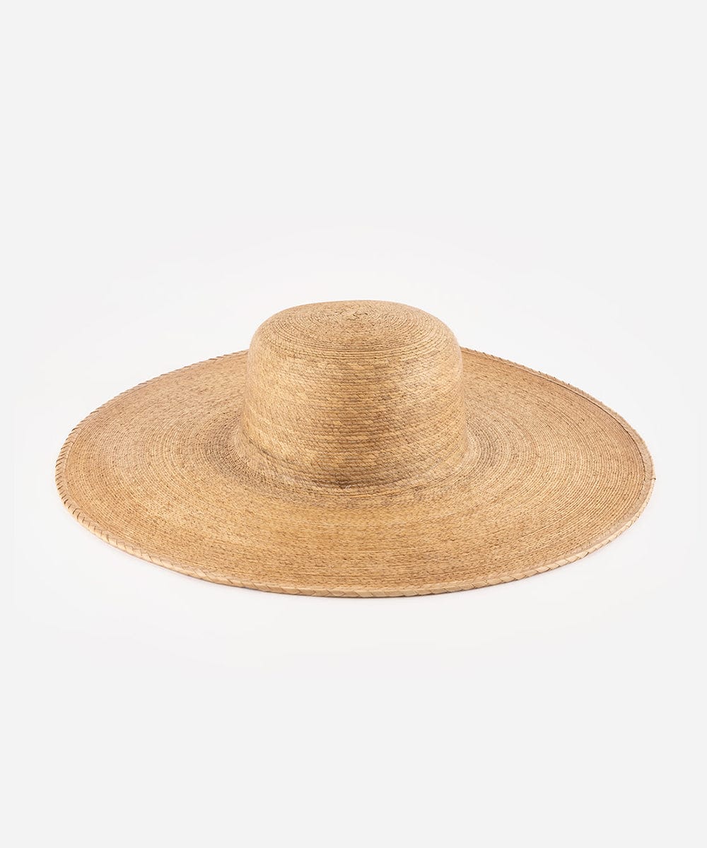 A natural brown colored wide brim boater hat made of straw, displayed against a white background. #color_natural brown